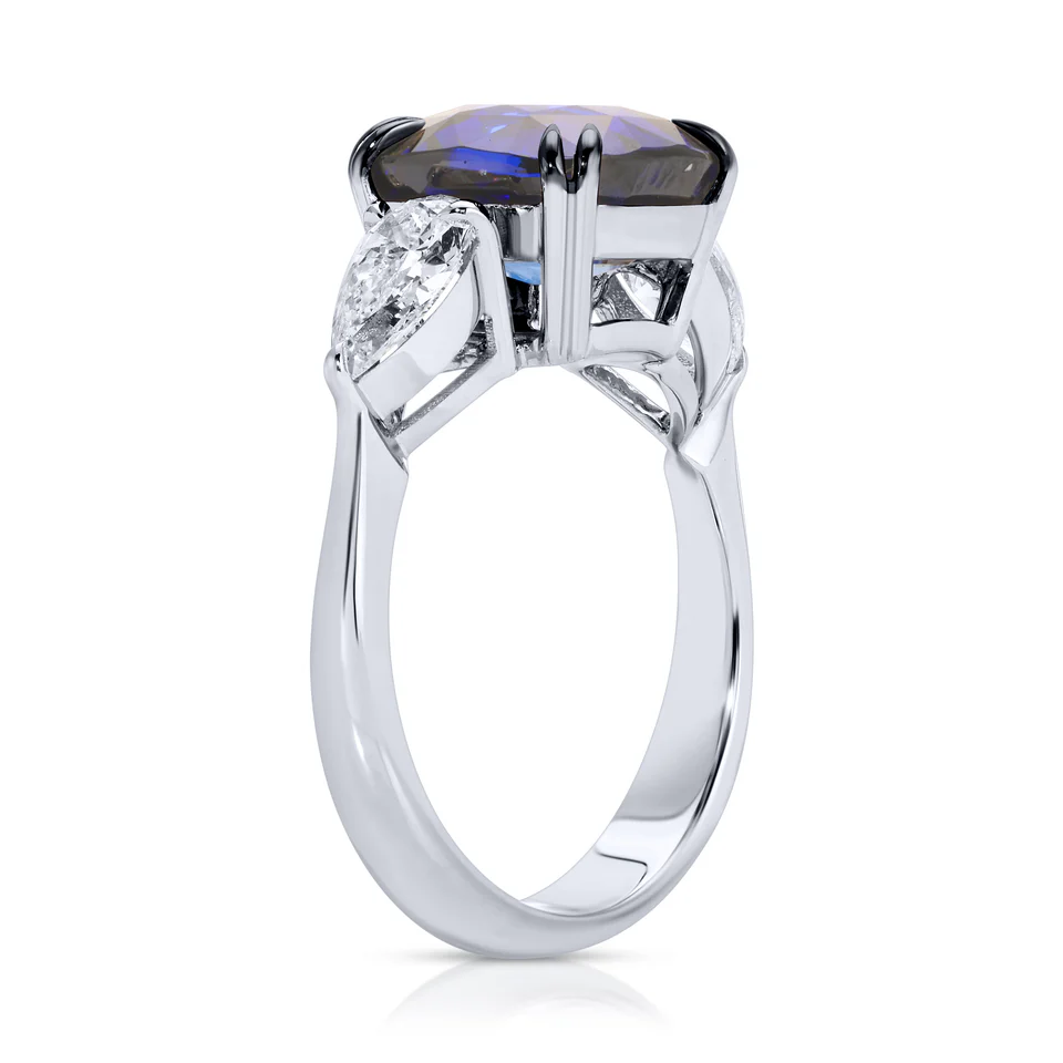 CUSHION CUT BLUE SAPPHIRE AND PEAR SHAPE DIAMOND RING